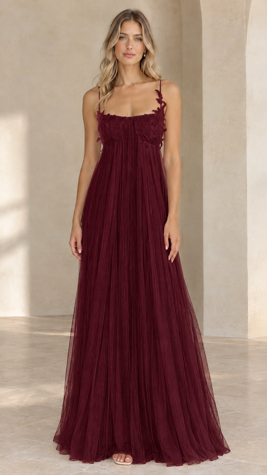 Full length view of rich burgundy pleated tulle maxi evening gown