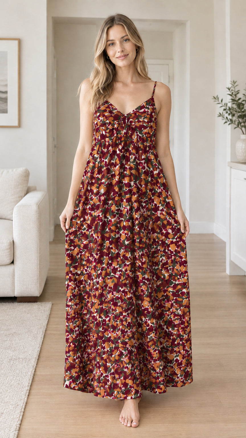 Front view of woman wearing burgundy wine floral backless maxi dress