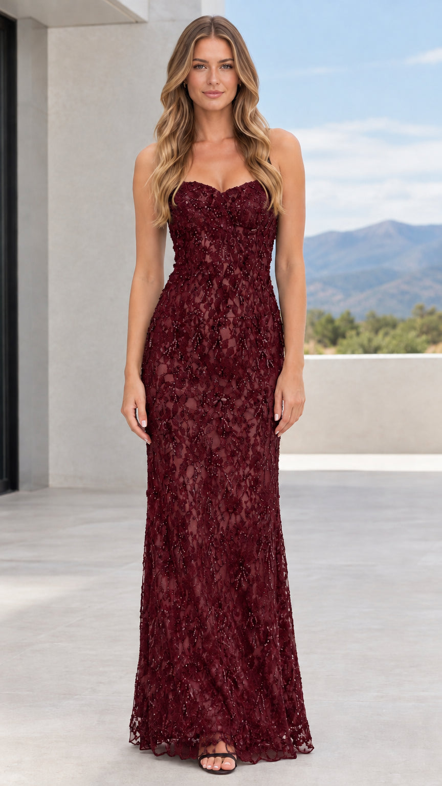 Model wearing burgundy wine strapless beaded lace column evening gown