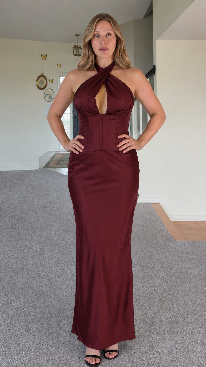 Front full-length view of woman wearing burgundy wine red cross halter top and maxi skirt set