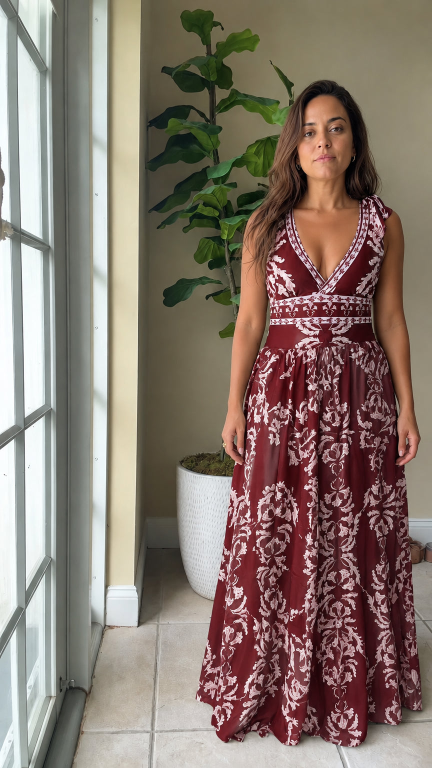 Front view of woman wearing burgundy wine red floral print V-neck sleeveless maxi dress