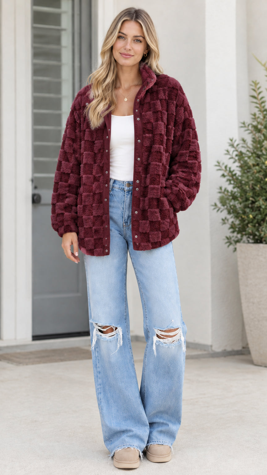 Model wearing burgundy wine red textured checkerboard plush fleece jacket