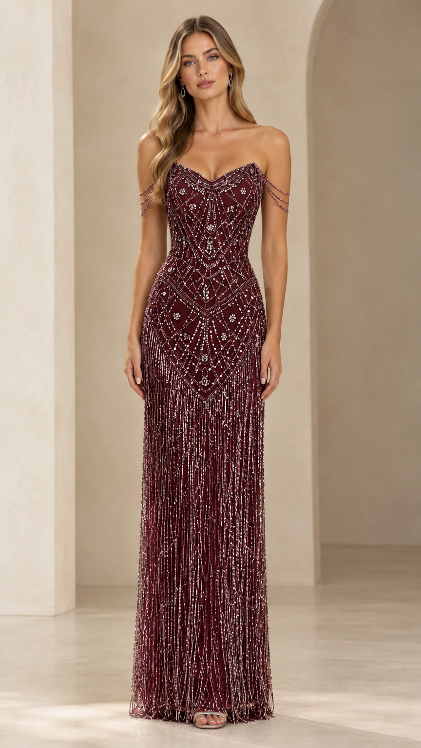 Front view of model wearing a deep burgundy wine beaded fringe maxi gown