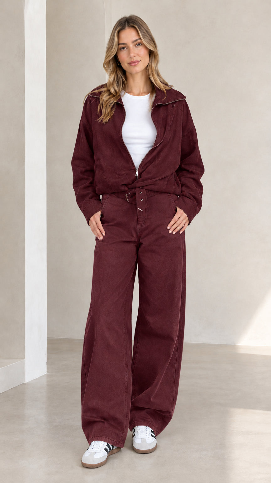 Woman wearing full burgundy two-piece utility jacket and wide-leg pants set