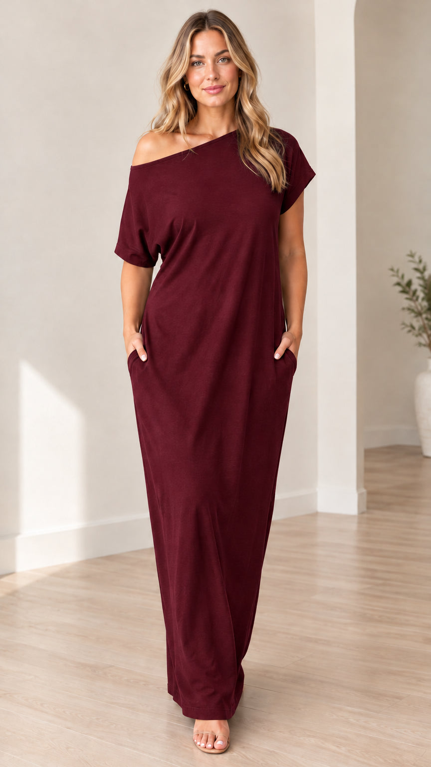 Front view of woman wearing burgundy wine off-shoulder short sleeve maxi dress with pockets