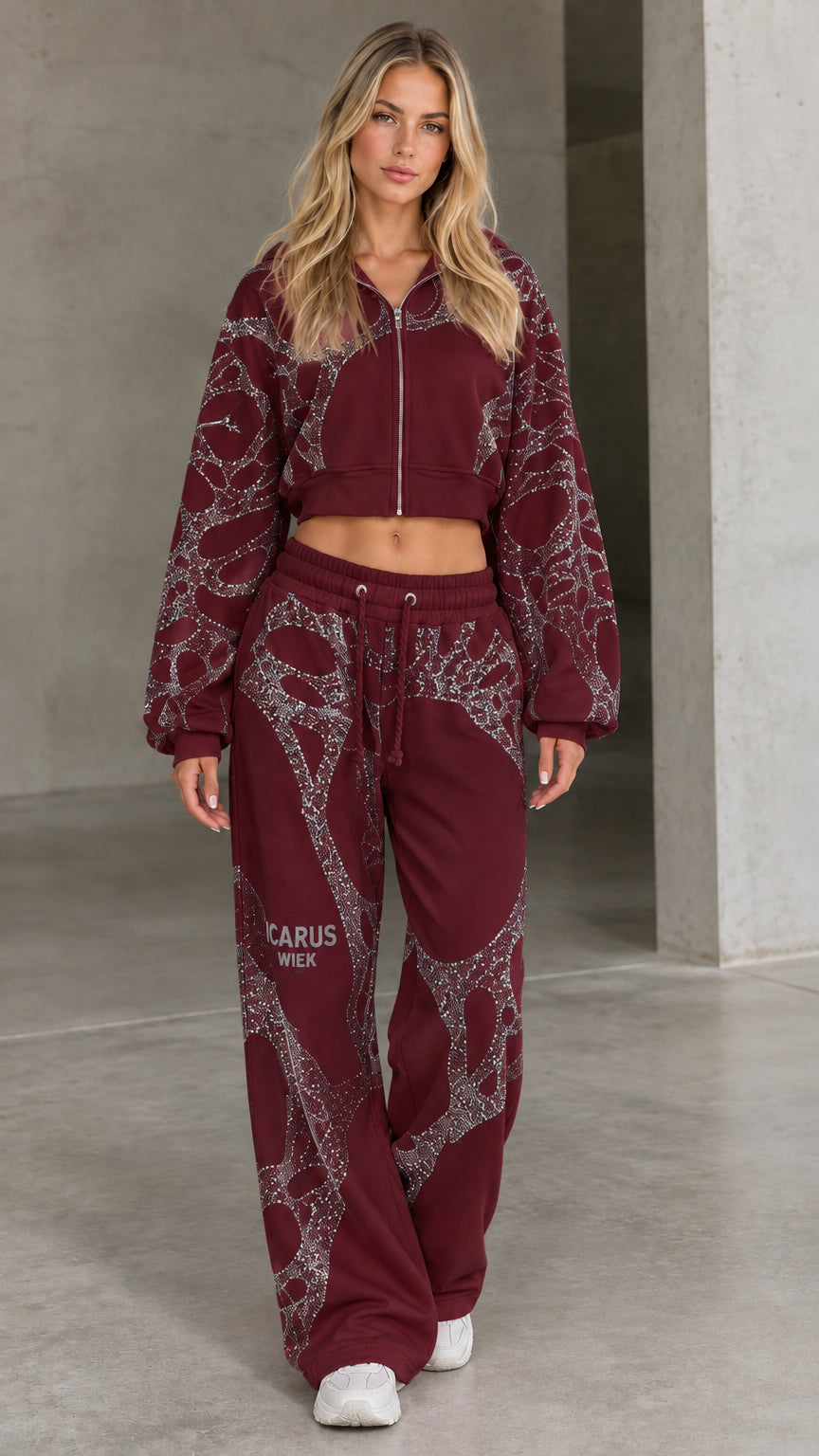 Front view of woman wearing burgundy rhinestone cropped hoodie and wide-leg sweatpants set