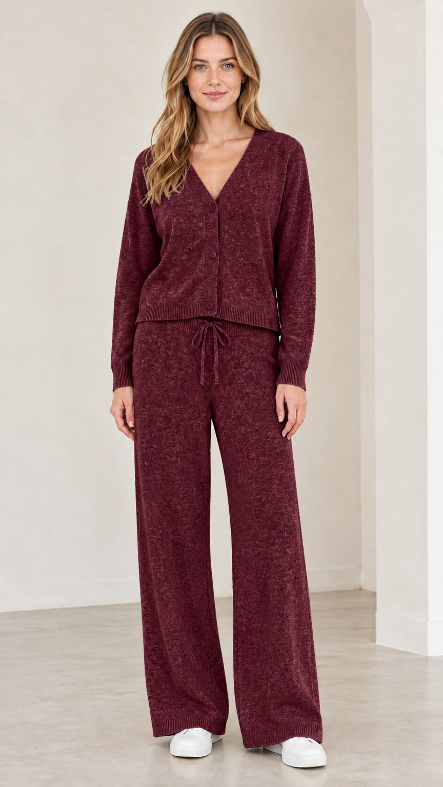 Front full view of woman wearing burgundy knit cardigan and lounge pants set