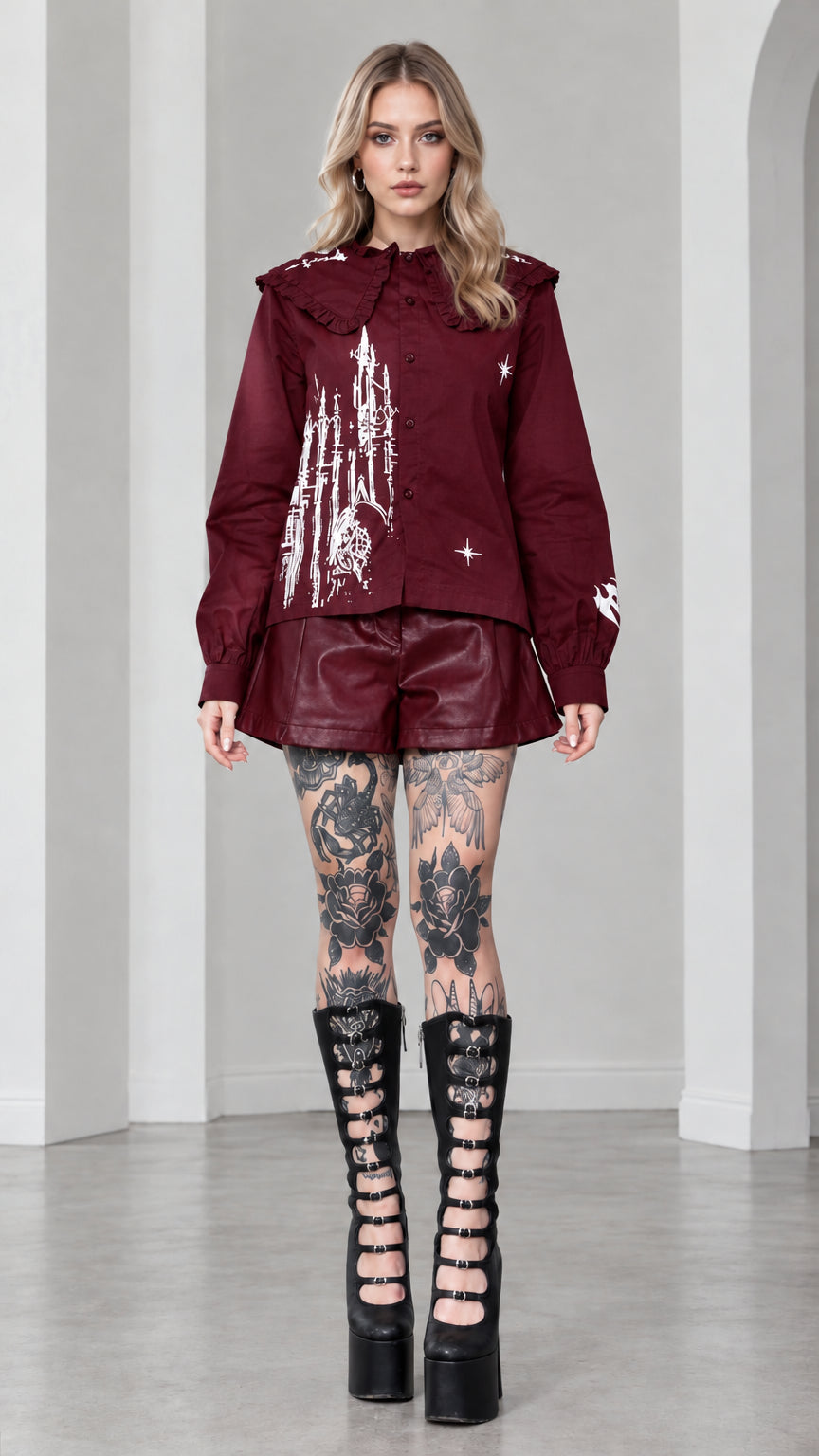 Full front view of model wearing burgundy wine red gothic castle print ruffled collar blouse