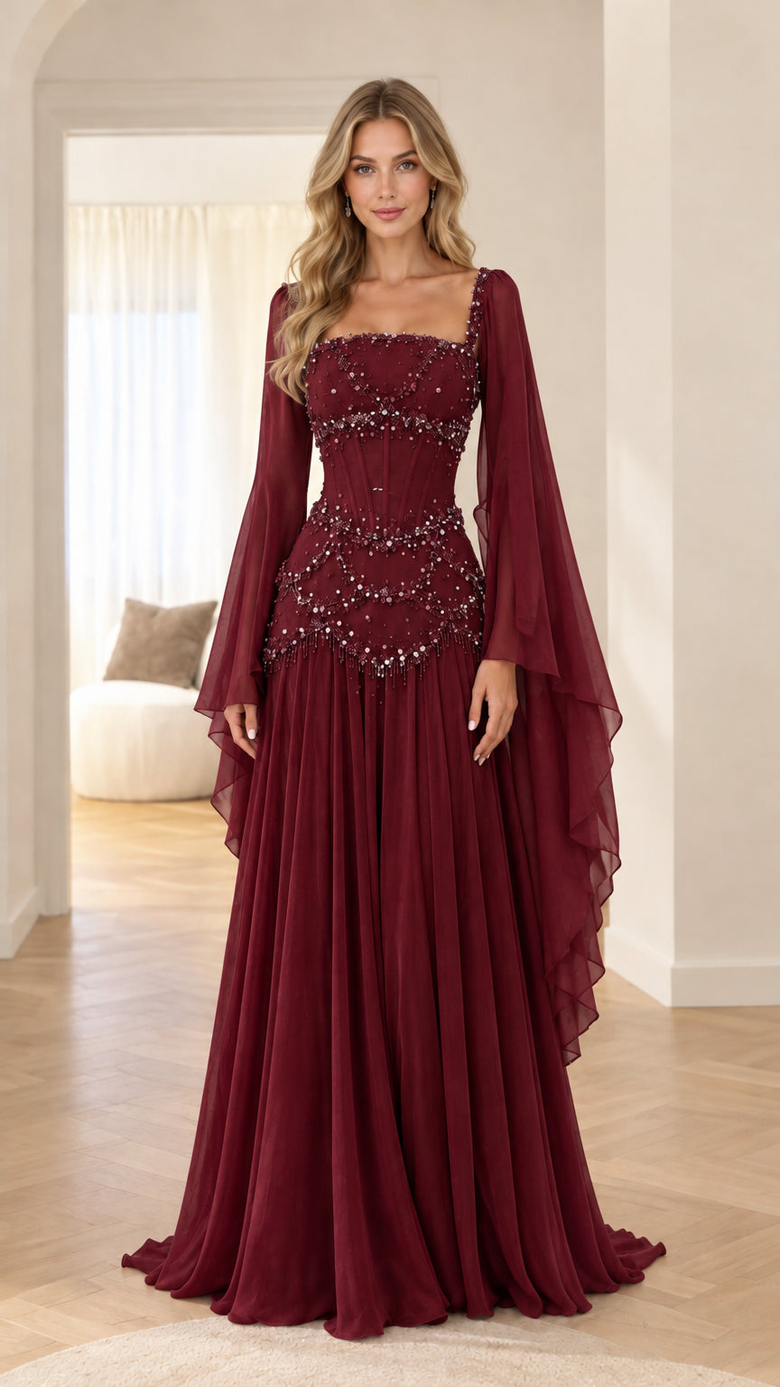 Front view of model wearing burgundy red beaded corset maxi dress with draped sheer sleeves