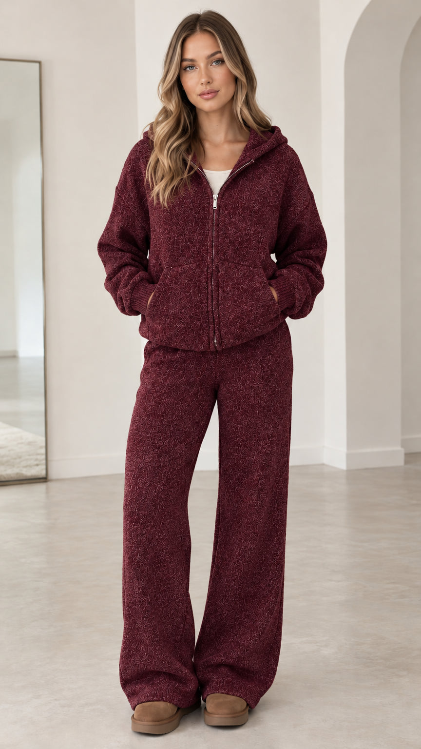 Front full-length view of model wearing burgundy textured knit zip hoodie and pants set