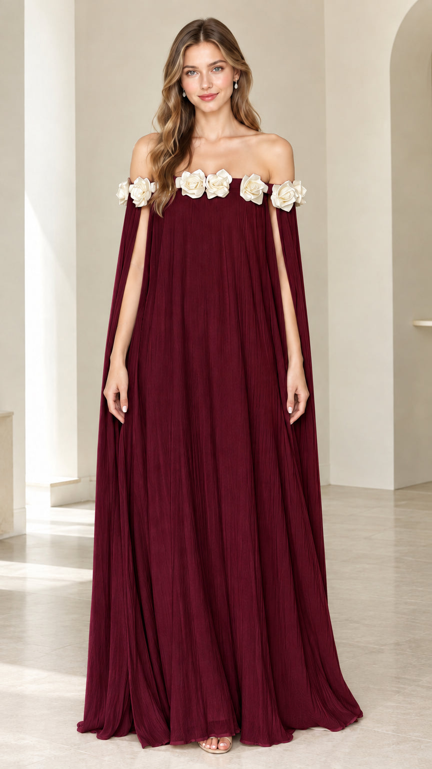 Burgundy wine red off-the-shoulder pleated cape maxi dress with ivory floral rosette trim