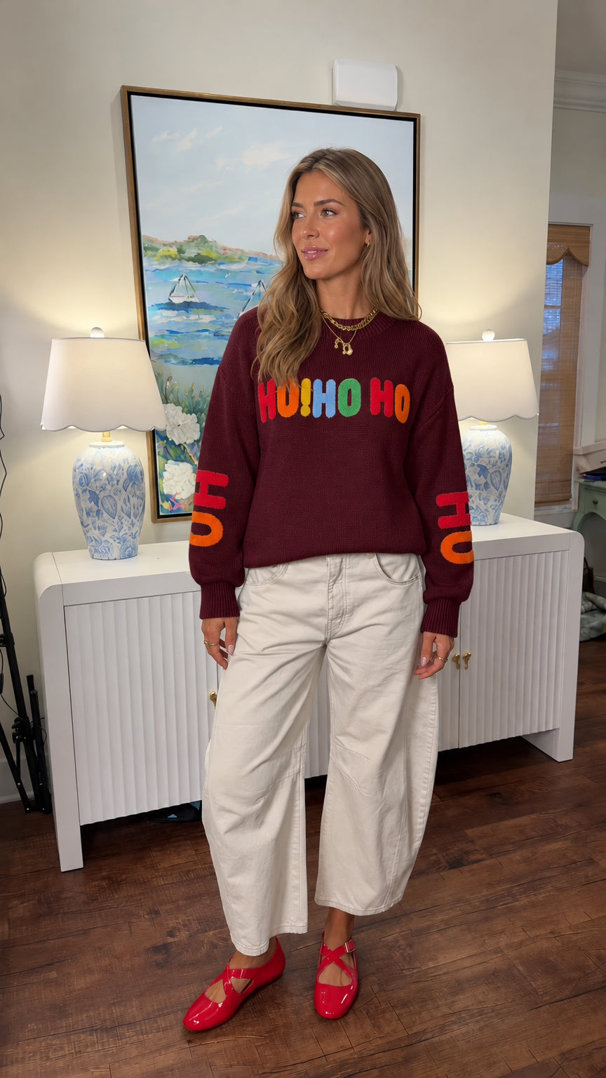 Woman wearing burgundy wine Ho Ho Ho embroidered crewneck sweater