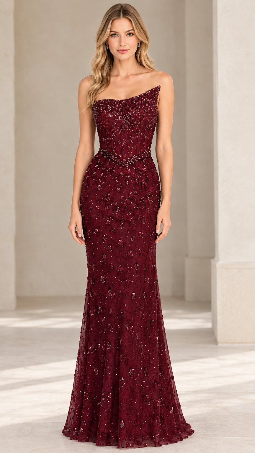 Front view of burgundy beaded strapless evening dress