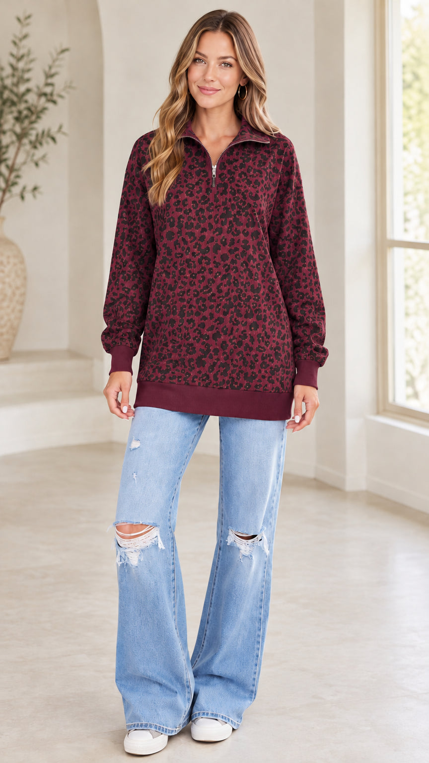 Model wearing burgundy red leopard print quarter-zip pullover sweatshirt