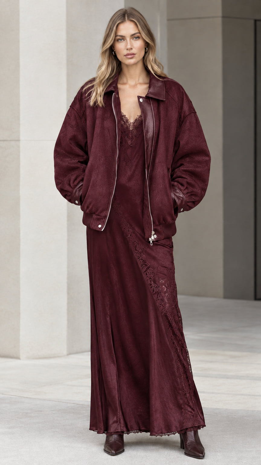 Model wearing burgundy wine red bomber jacket and matching slip dress set