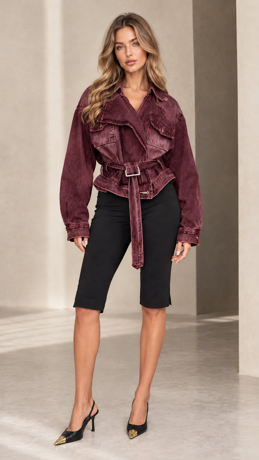Model wearing a burgundy maroon belted utility denim jacket