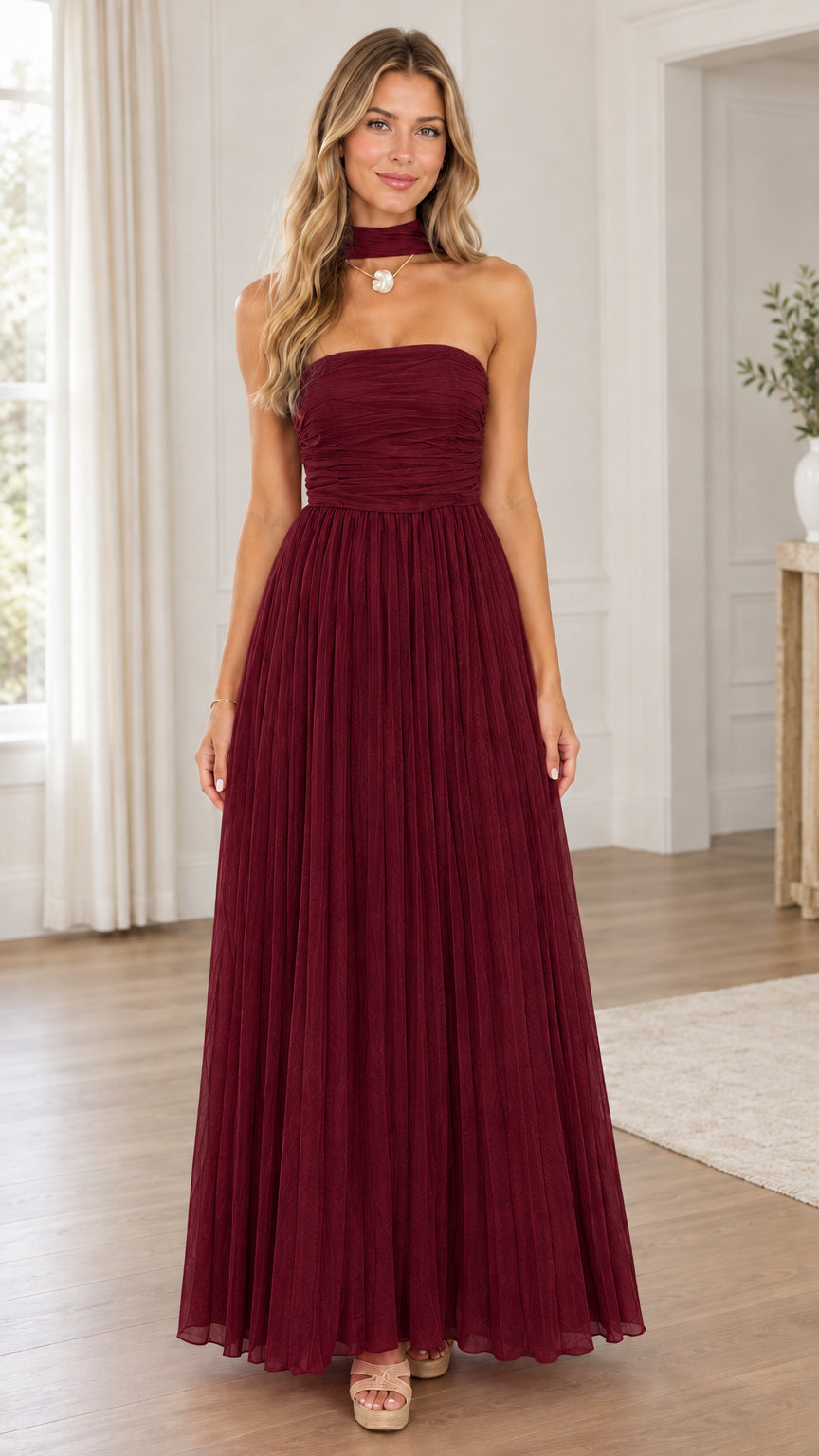 Front full view of solid burgundy wine red strapless pleated evening dress