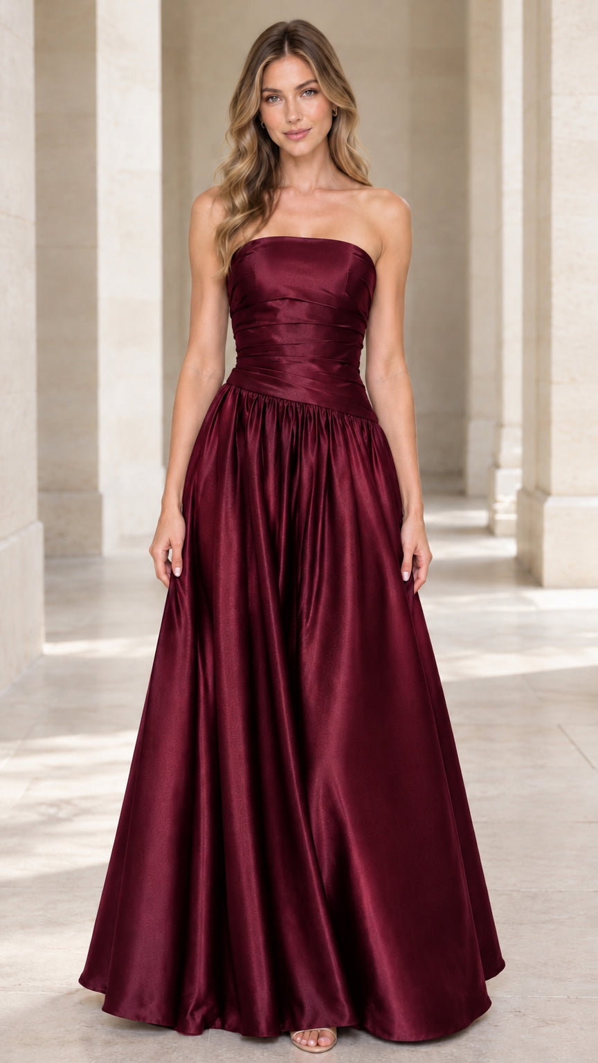 Full-length front view of burgundy wine red strapless pleated satin A-line maxi dress