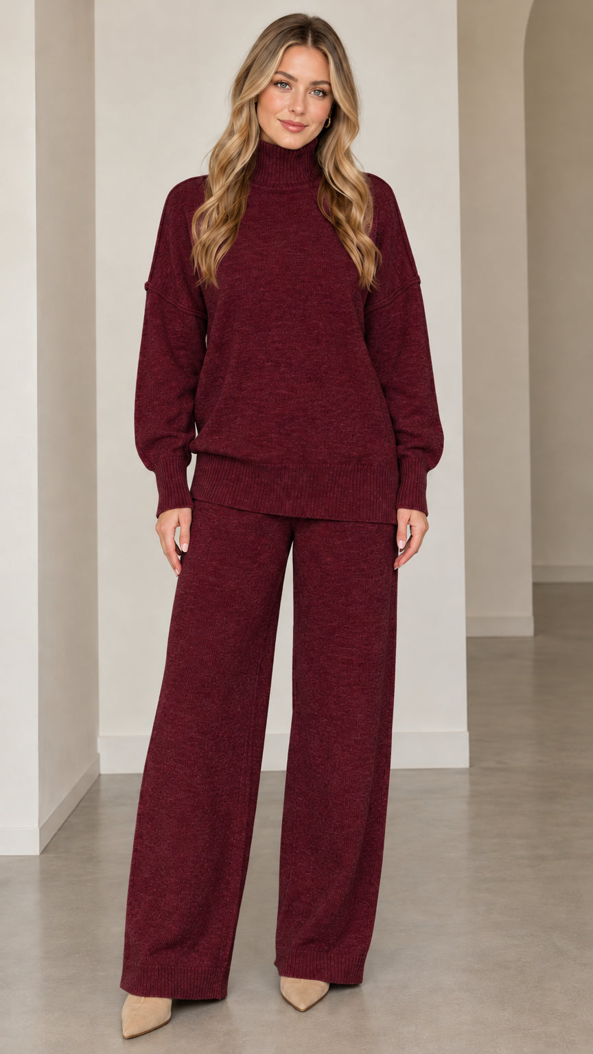 Front full-length view of model wearing burgundy knit turtleneck sweater and matching wide-leg pants