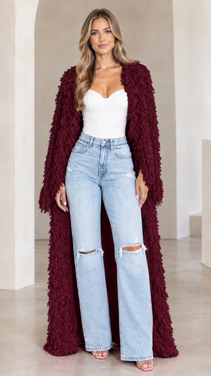Front view of model wearing burgundy textured shaggy maxi duster cardigan