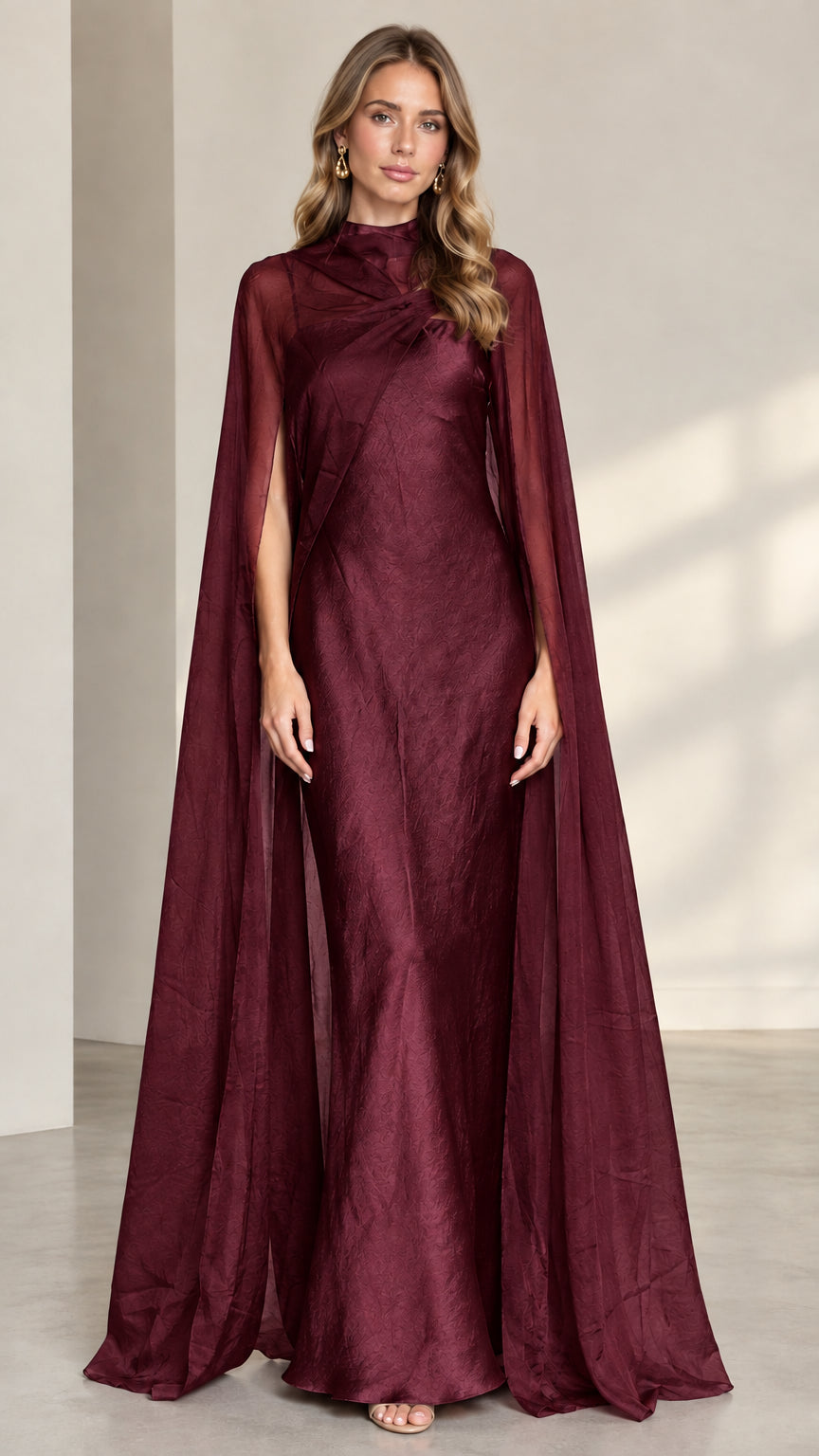 Burgundy high neck maxi evening gown with sheer cape overlay