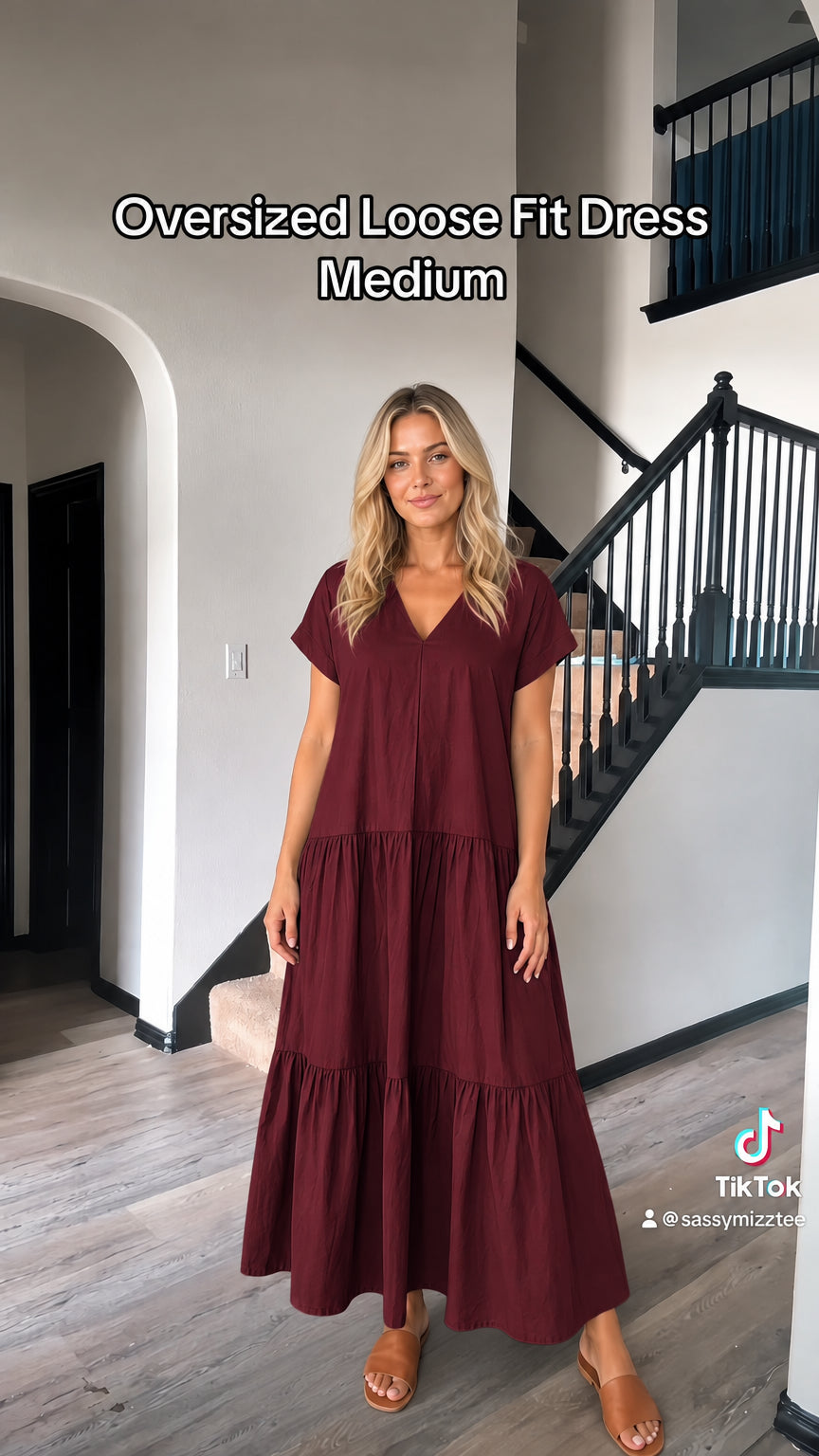 Front view of woman wearing burgundy wine red tiered maxi dress