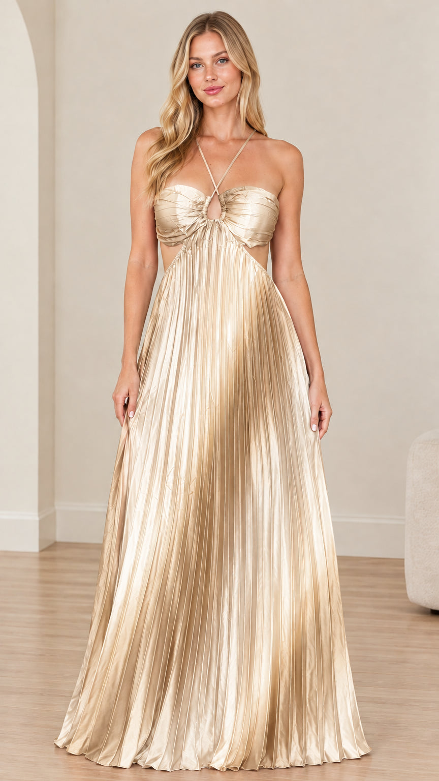 Front view of model wearing champagne gold pleated halter cutout maxi dress