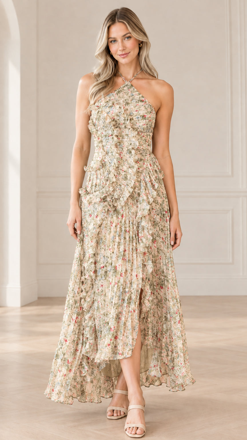 Front full-length view of model wearing champagne beige floral halter neck pleated maxi dress