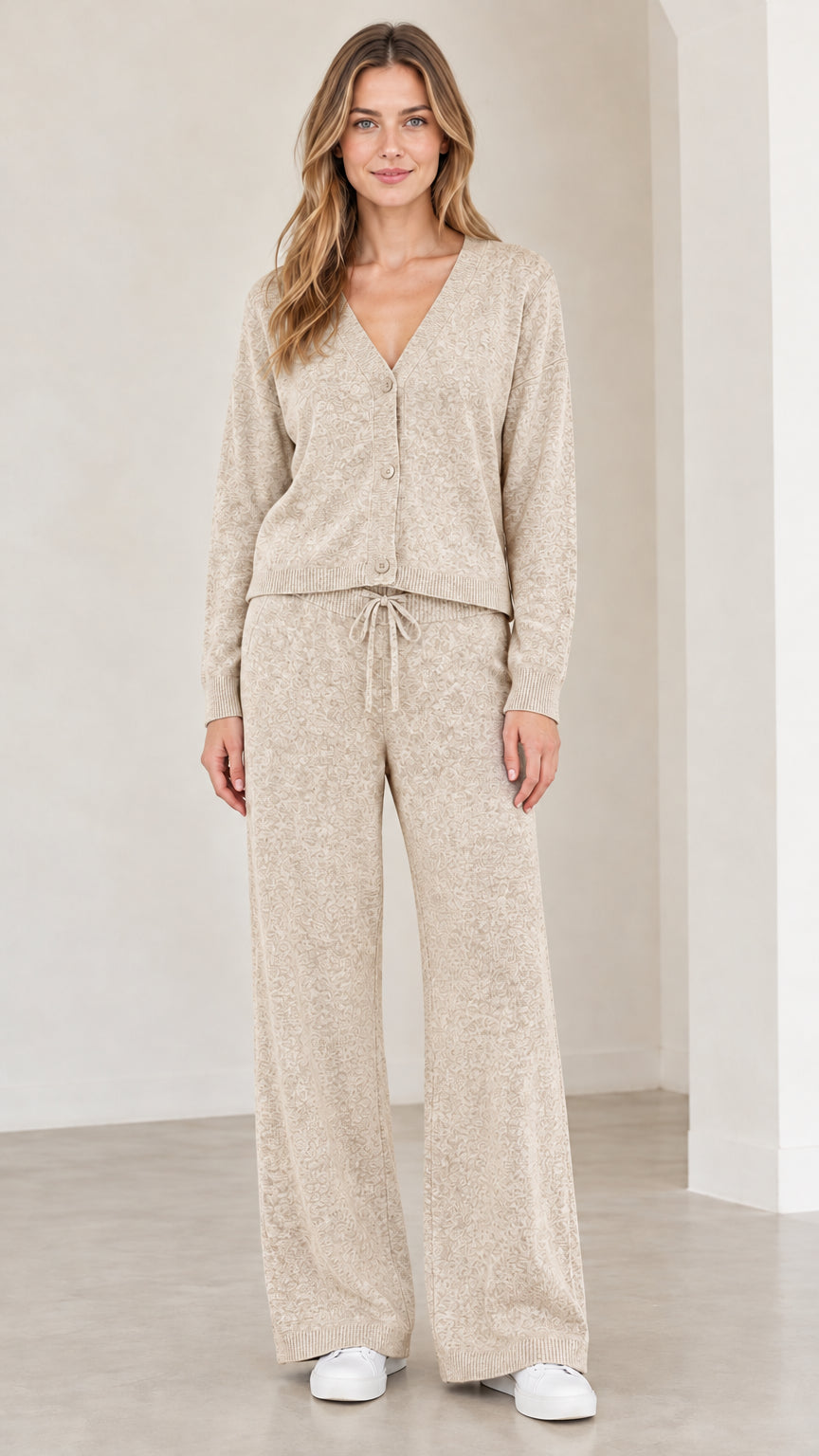 Front full view of woman wearing oatmeal beige knit cardigan and pants set