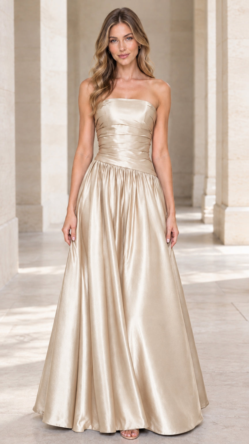Full-length front view of champagne gold strapless pleated satin formal ball gown