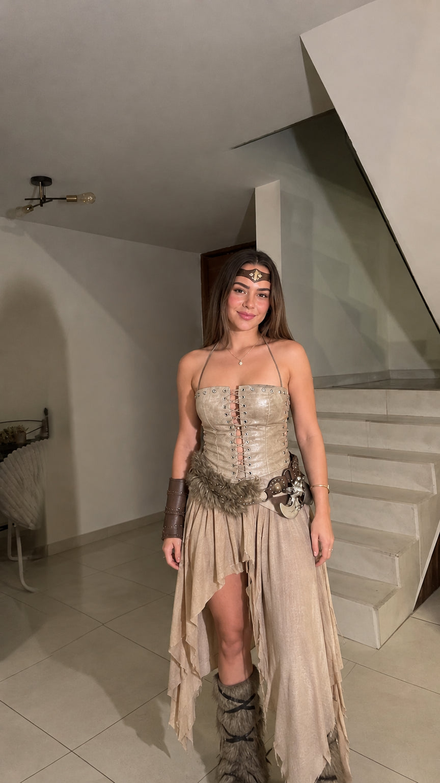 Woman modeling the beige tan Viking warrior lace-up corset top and flowing asymmetrical skirt set