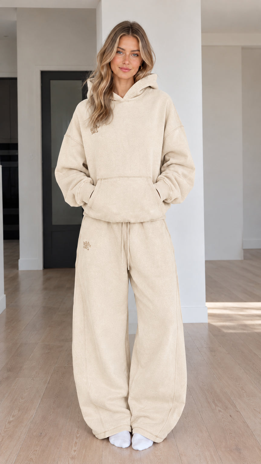 Front view of model wearing Cream oversized hoodie and wide-leg sweatpants set