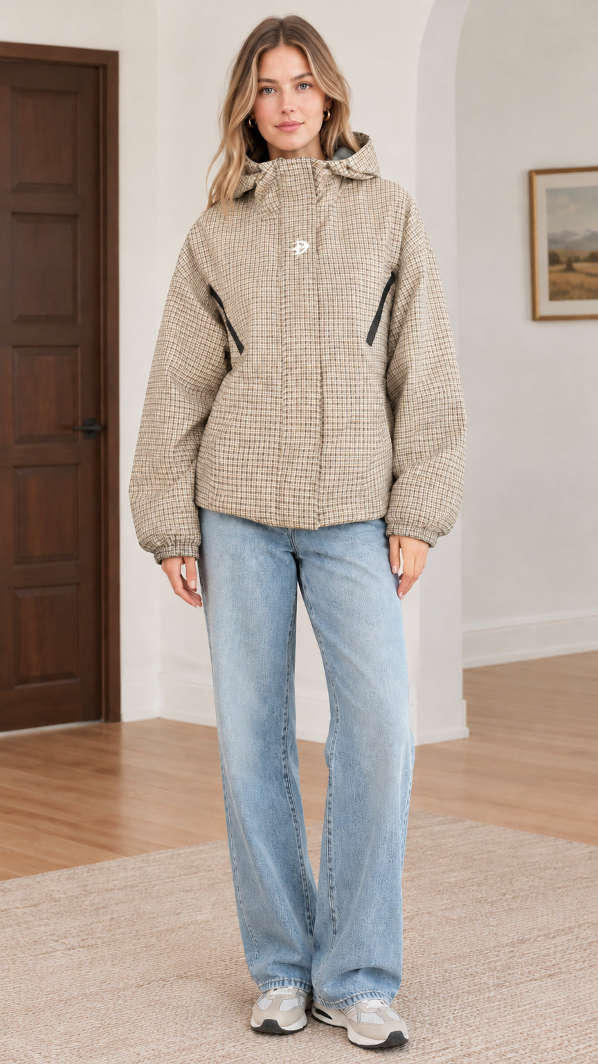 Front view of beige khaki houndstooth hooded jacket styled with light blue jeans