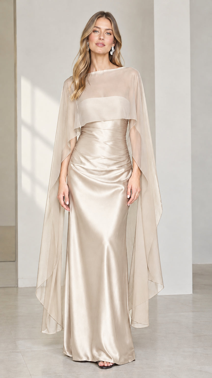 Full front view of champagne gold satin evening gown with sheer drape cape