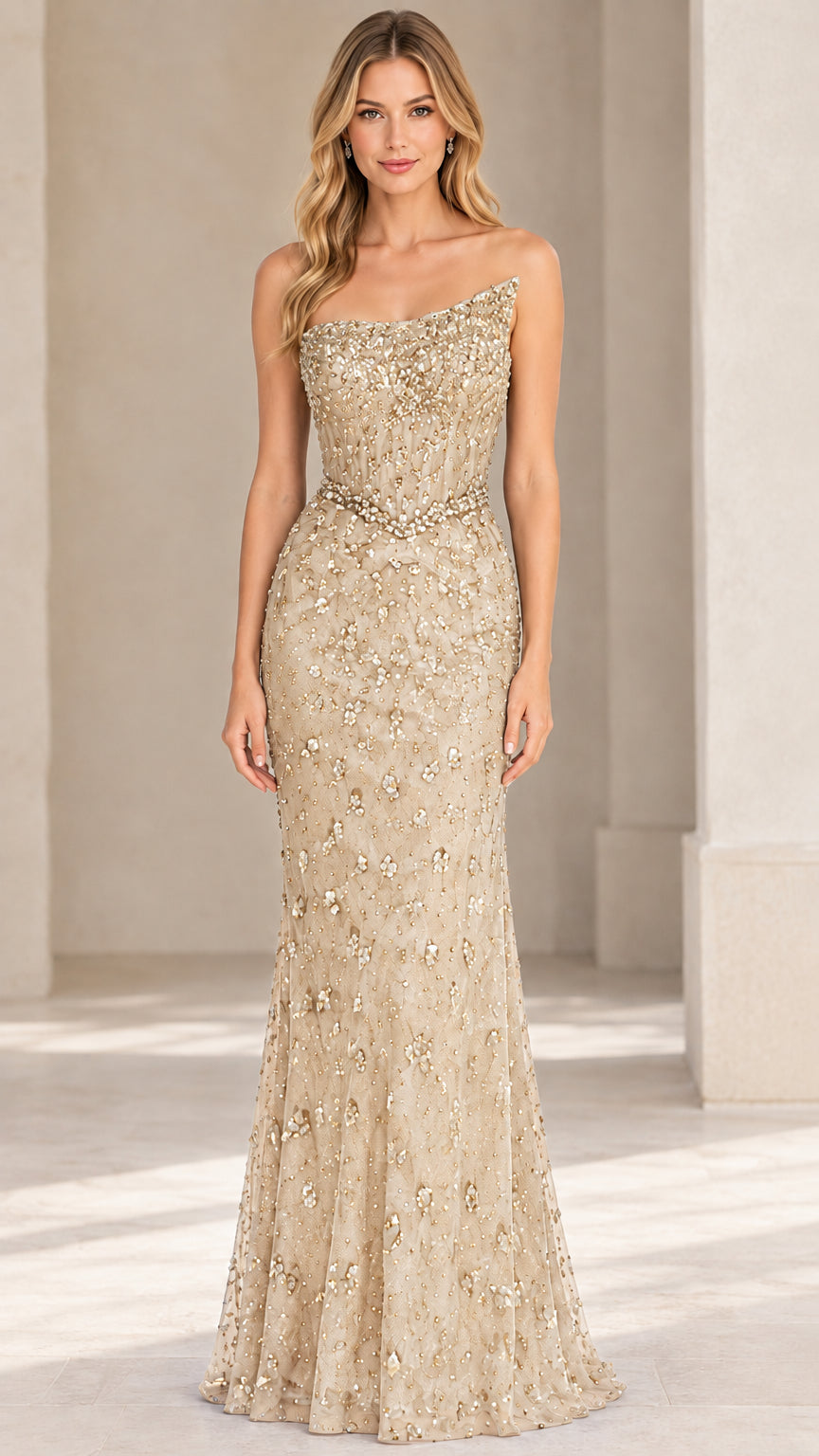 Front view of champagne gold beaded strapless formal gown