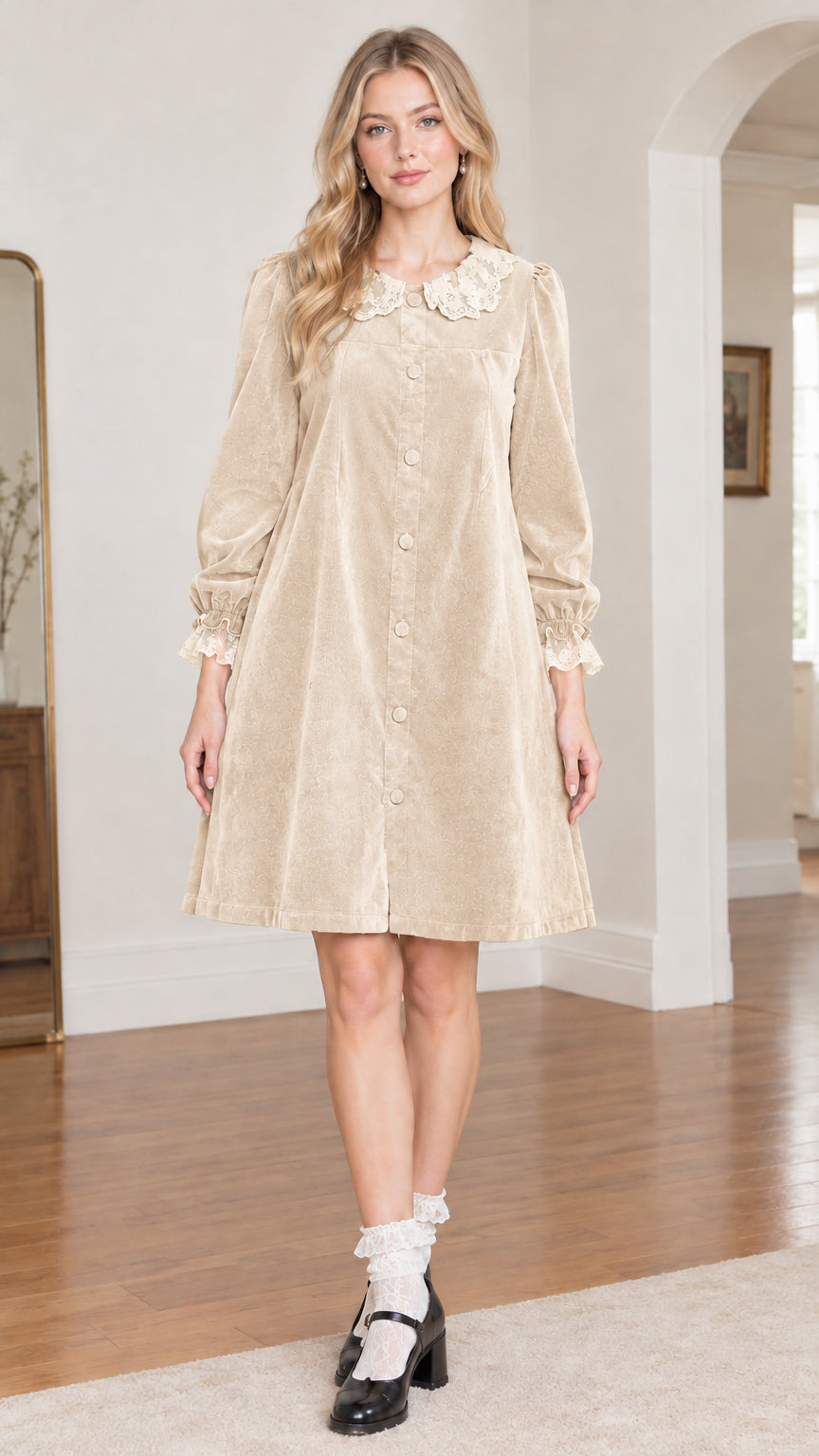 Front view of model wearing beige champagne velvet babydoll dress with lace collar