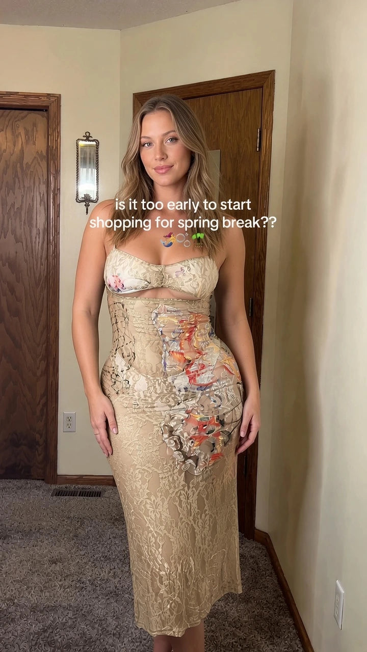 Front view of model wearing Champagne beige strapless floral lace cutout midi dress