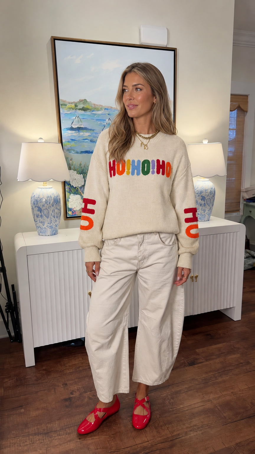 Woman modeling cream beige Ho Ho Ho holiday knit sweater