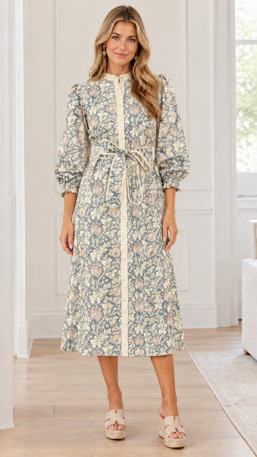 Front view of woman wearing sage cream floral print button-front midi dress