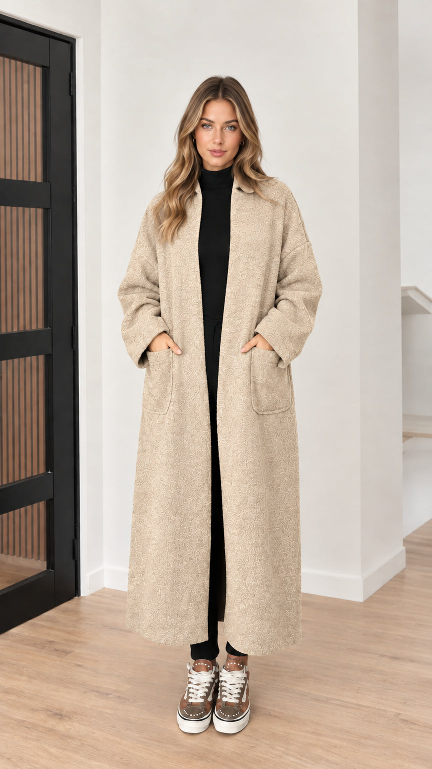 Front view of model wearing oat beige textured longline coat